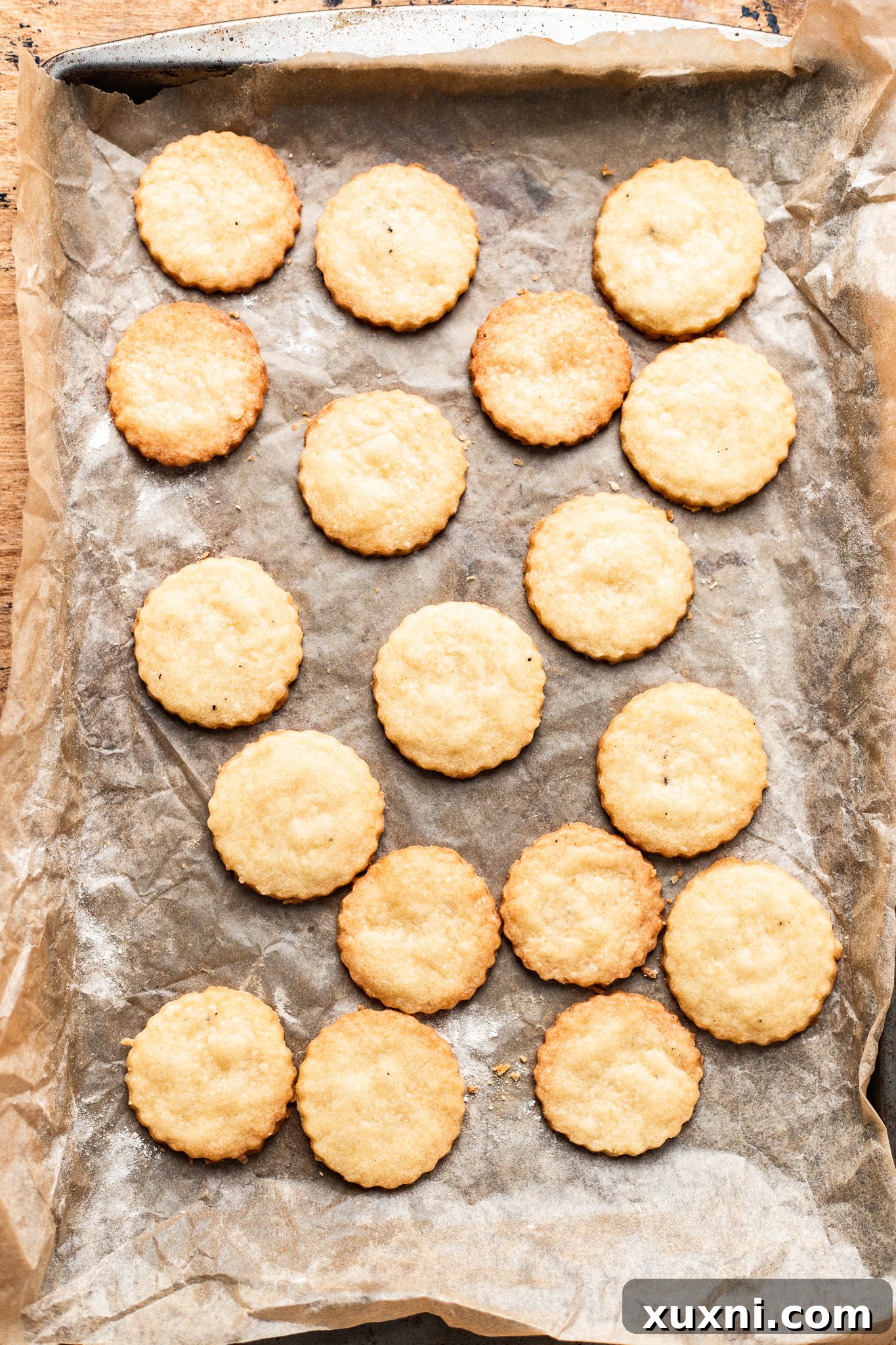 Baked vegan shortbread cookies cooling on a baking sheet