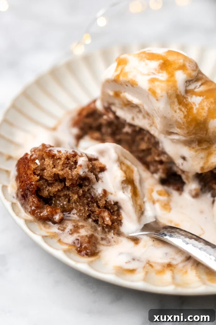 Simply Divine Vegan Sticky Toffee Pudding 15 A plate with the last bites of a vegan sticky toffee pudding, highlighting its delightful stickiness and rich sauce.