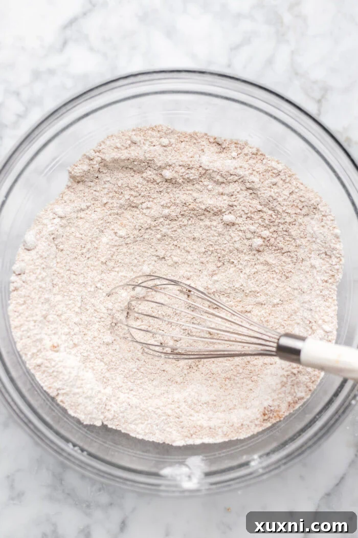 Simply Divine Vegan Sticky Toffee Pudding 5 Soaked Medjool dates in a bowl, ready to be pureed for the sticky toffee pudding recipe.