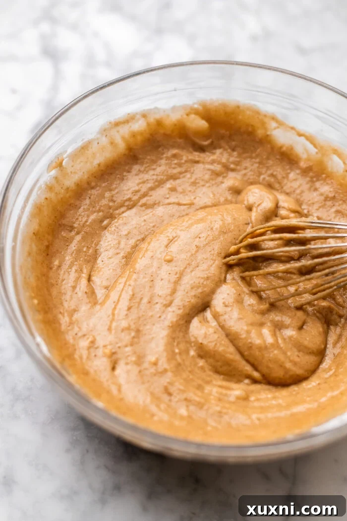 Simply Divine Vegan Sticky Toffee Pudding 6 Mixing the wet and dry ingredients with date puree to form the vegan sticky toffee pudding batter.