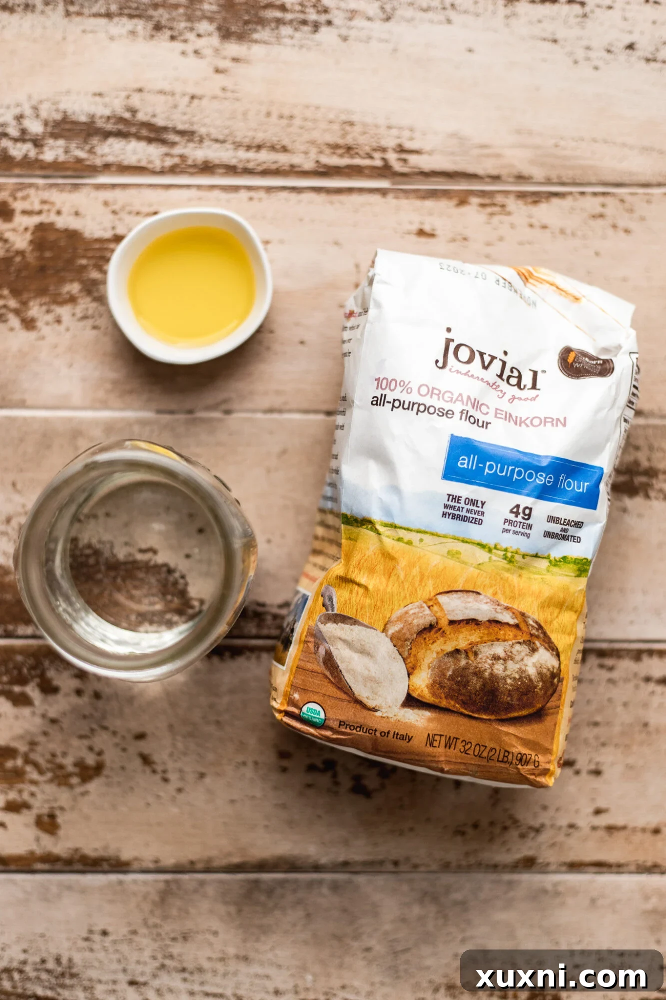 Simple ingredients for homemade vegan pasta: flour, salt, olive oil, and water.