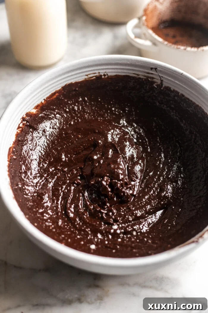 Smooth vegan lava cake batter in a bowl, ready for baking.