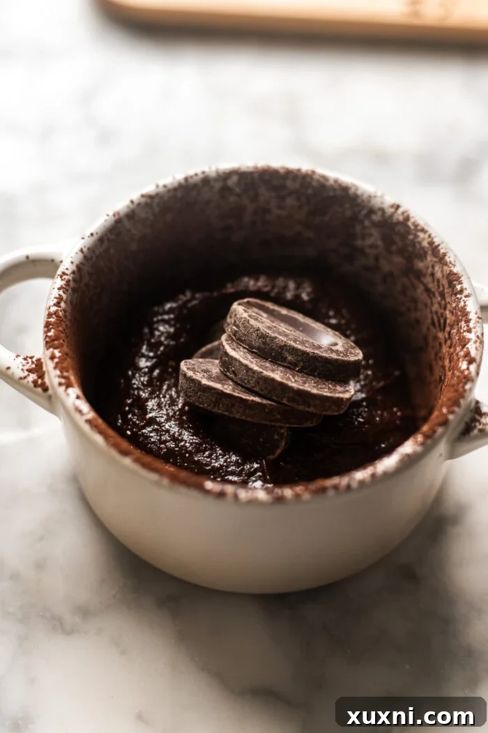 Ramekin partially filled with vegan lava cake batter.