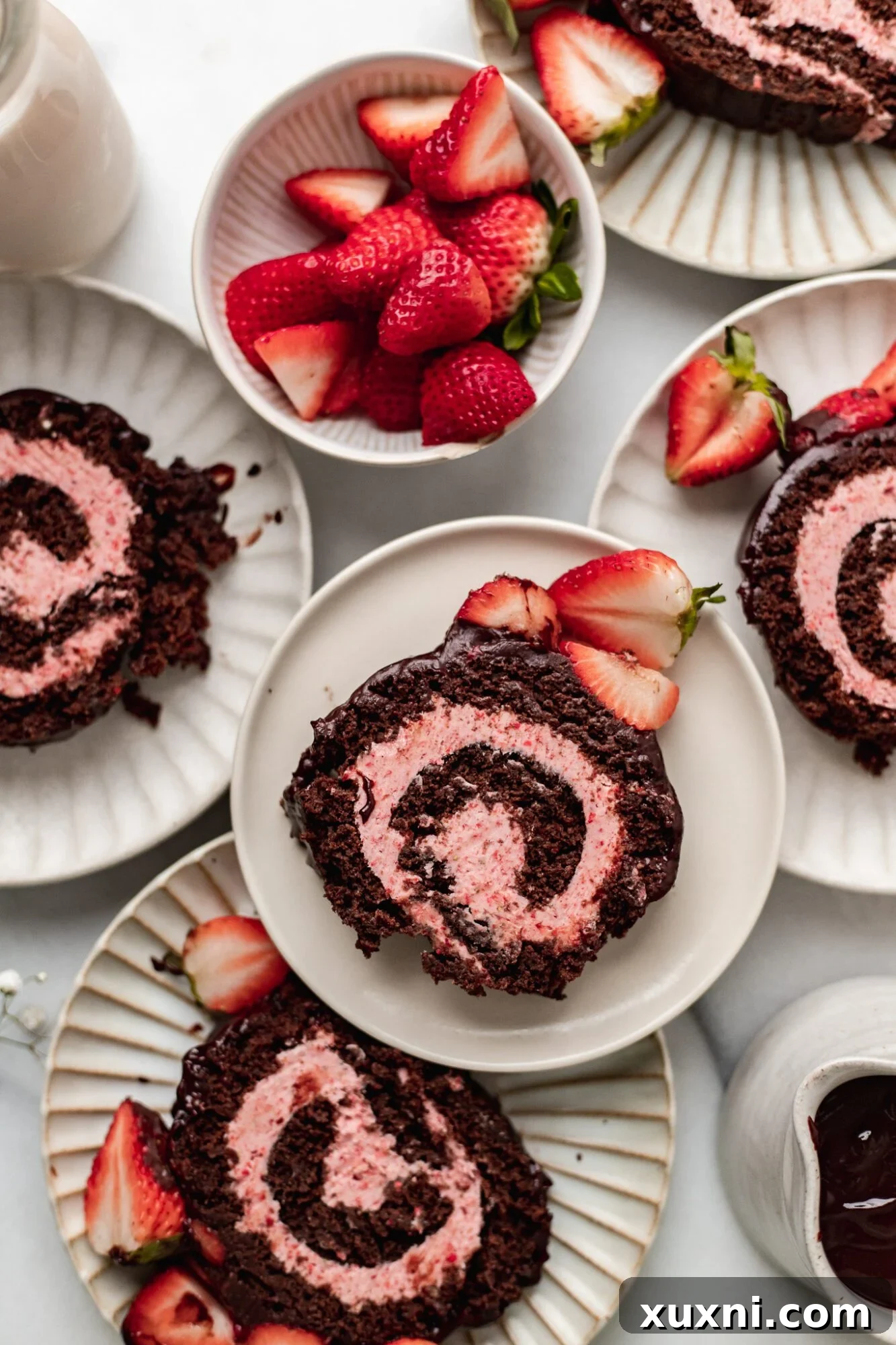 plates of chocolate Swiss roll
