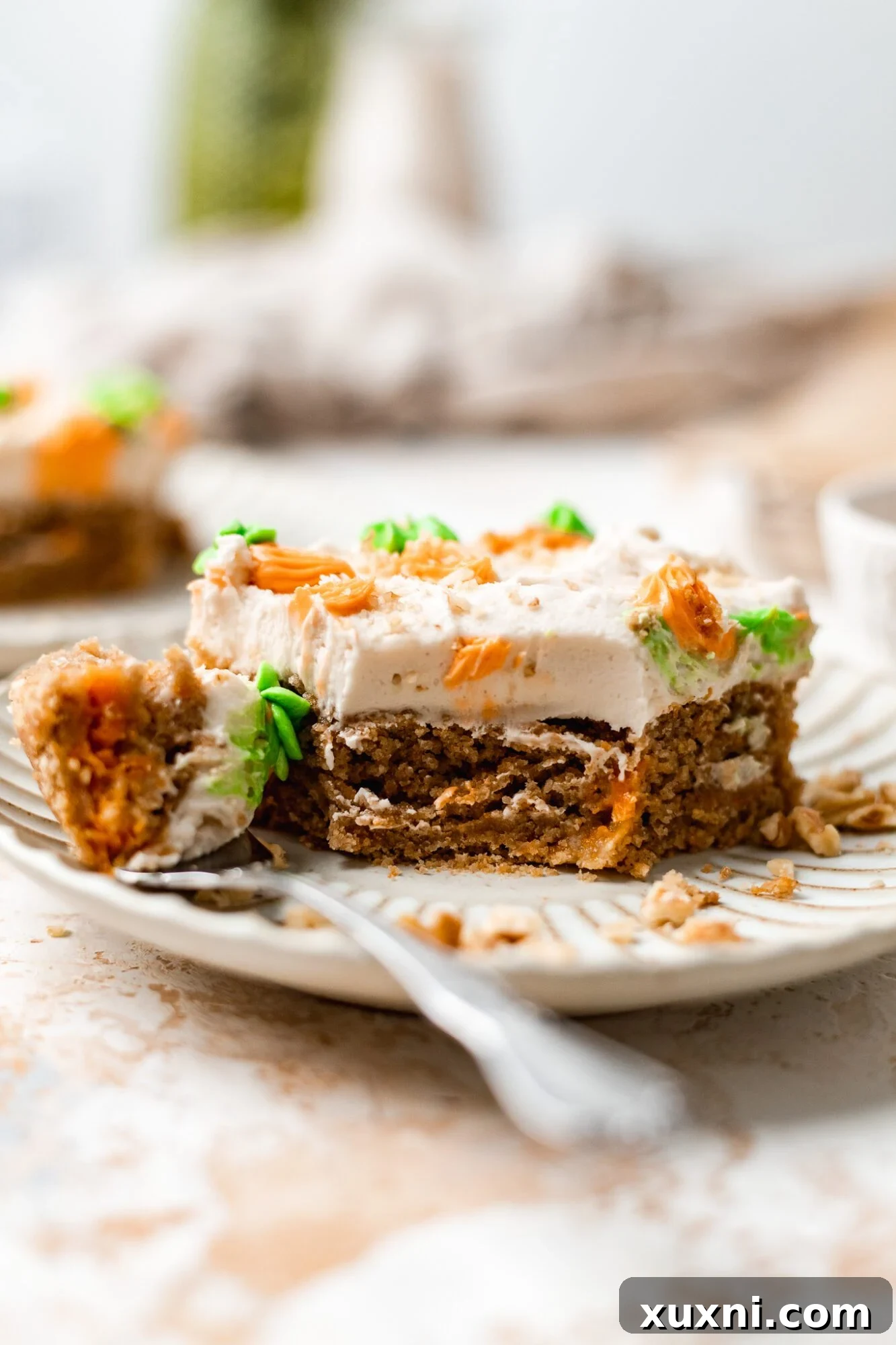 Irresistible Vegan Gluten Free Carrot Cake Bars 12 bitten carrot cake bar