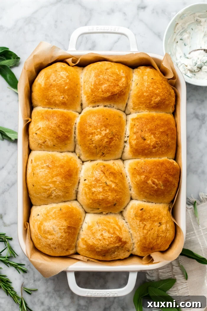 freshly baked golden vegan garlic dinner rolls cooling in a dish
