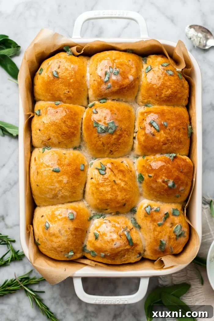 freshly baked vegan garlic dinner rolls brushed with herbed butter