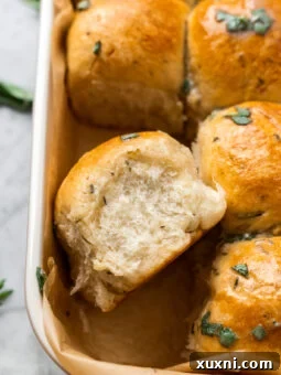 close up of garlic dinner roll in a casserole dish, golden and soft