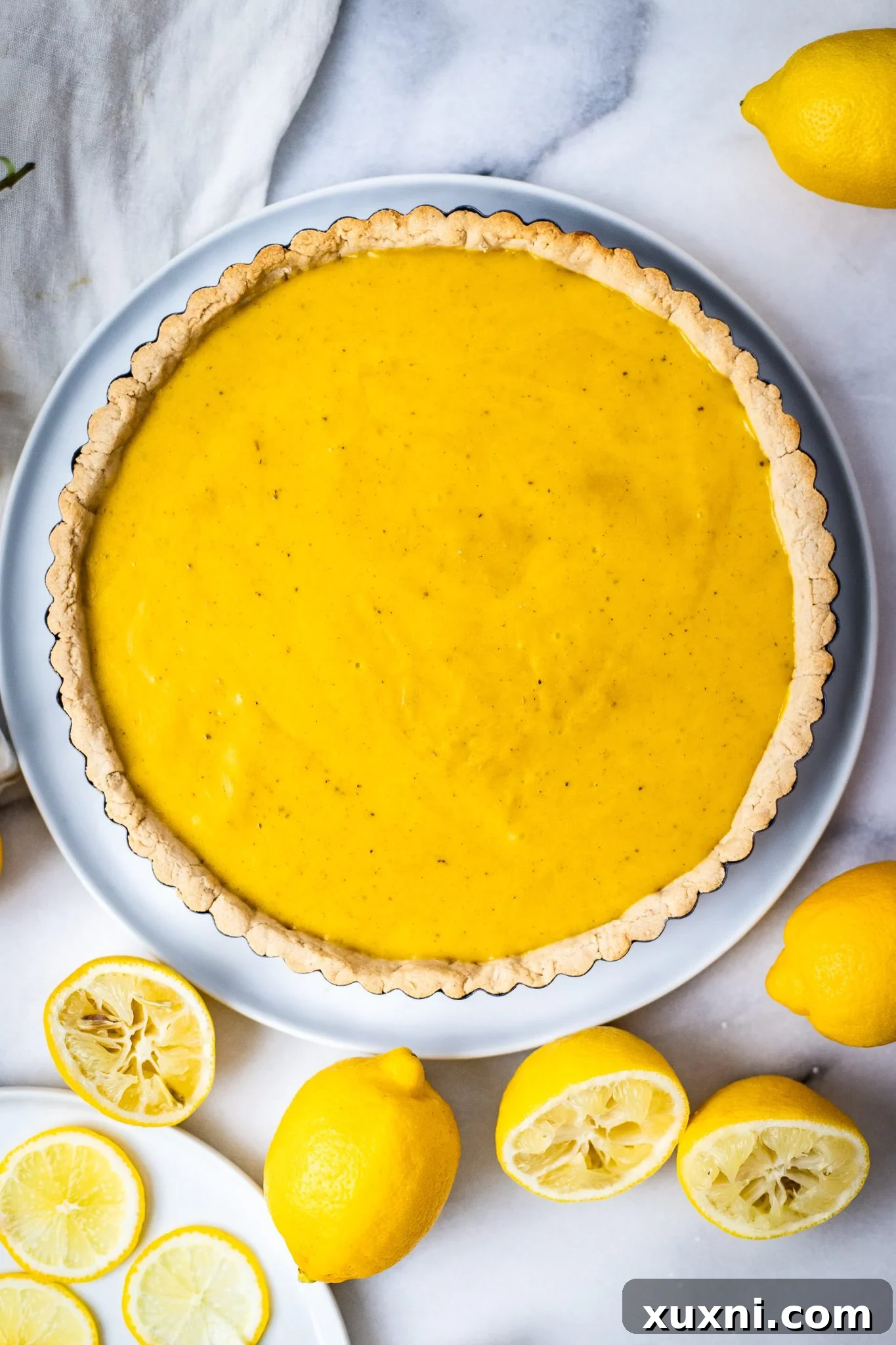 Set vegan lemon tart in a tart pan, ready for chilling.