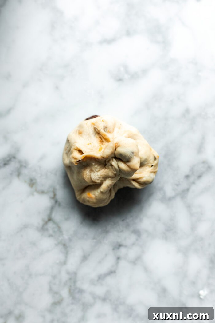 Whip Up Simple & Scrumptious Vegan Hot Cross Buns 11 shaping the dough