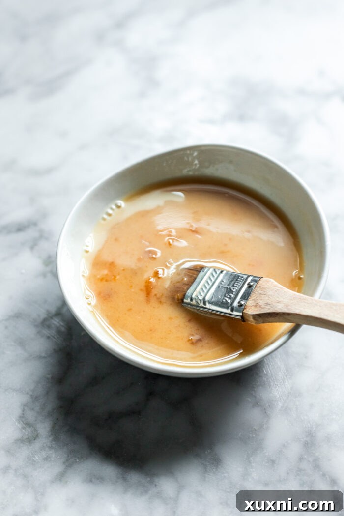 Whip Up Simple & Scrumptious Vegan Hot Cross Buns 15 apricot wash