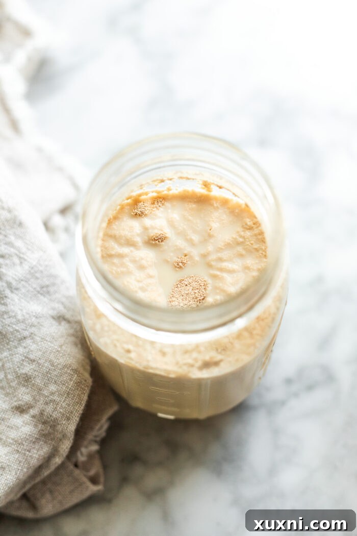 Whip Up Simple & Scrumptious Vegan Hot Cross Buns 5 heated dairy free milk with yeast bloomed