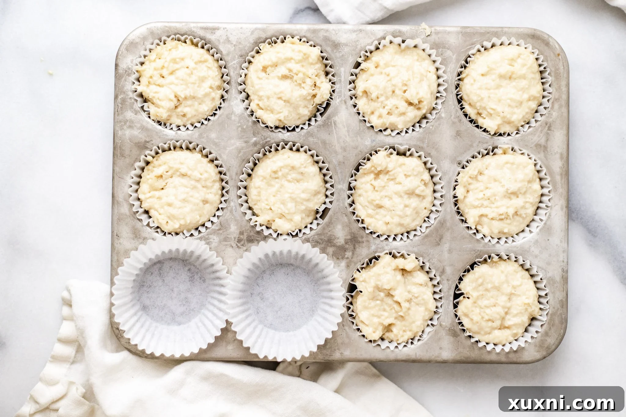 Decadent Vegan Coconut Cupcakes Gluten Free Adaptable 8 cupcake batter in cupcake tin