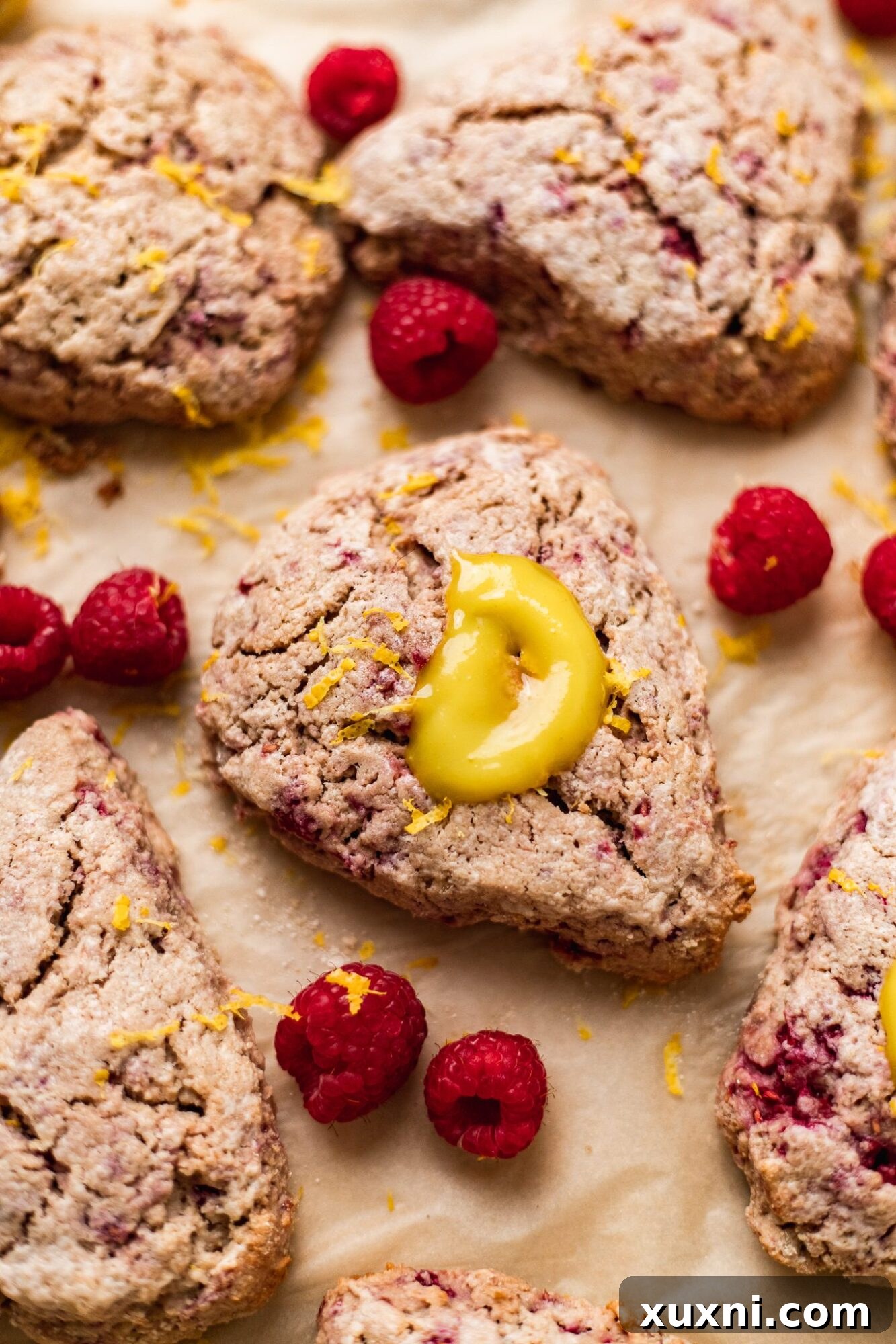 Plate of freshly baked vegan lemon raspberry scones.