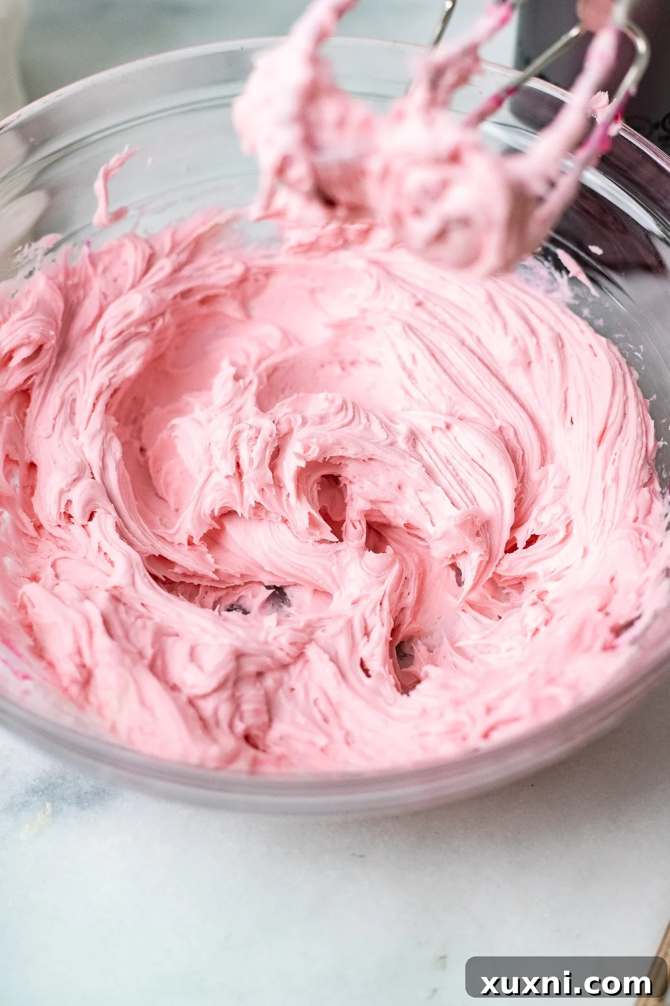 vegan pink frosting for vegan Lofthouse Cookies in a bowl