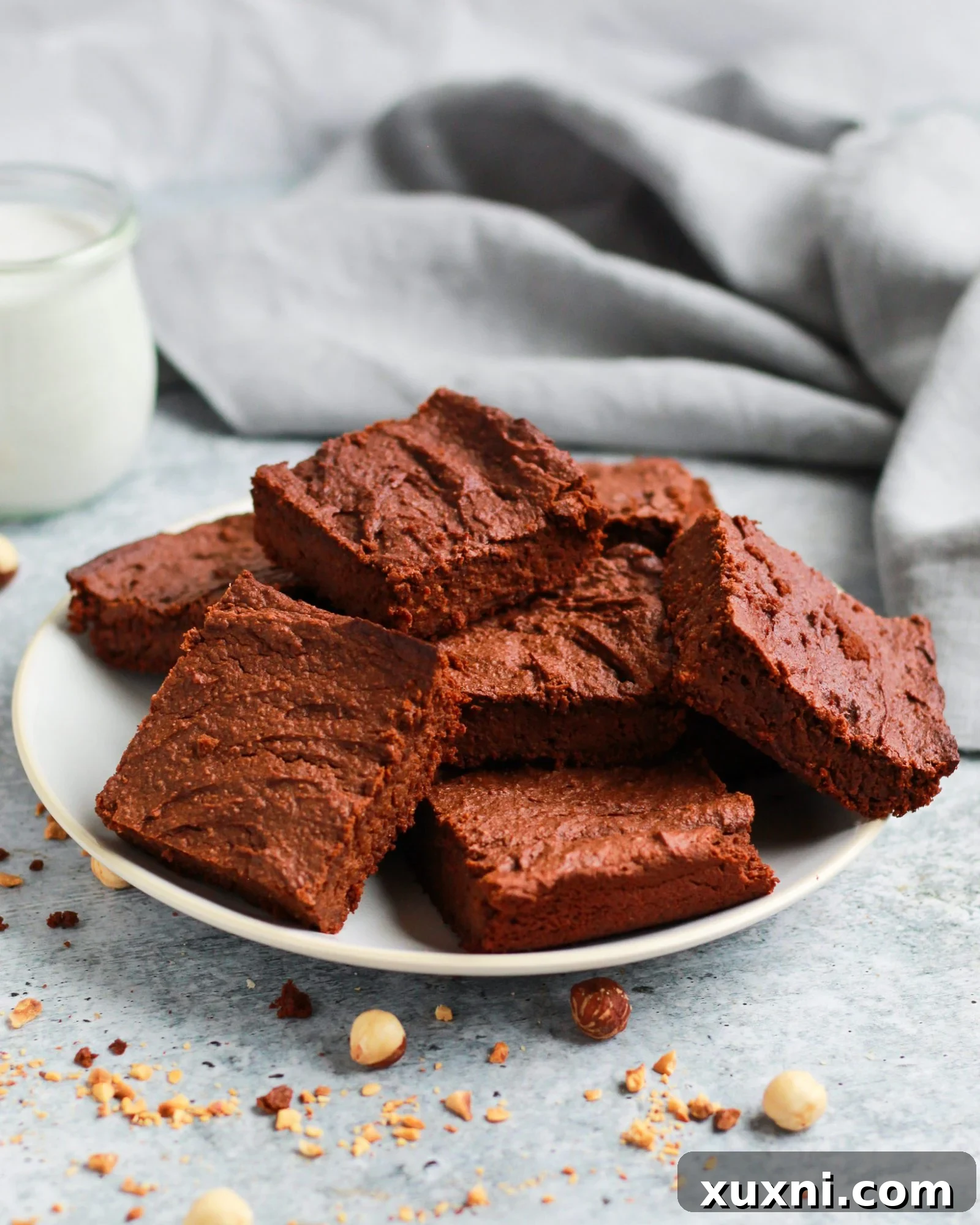 A plate featuring several healthy vegan Nutella brownies, perfectly arranged and ready to be enjoyed.