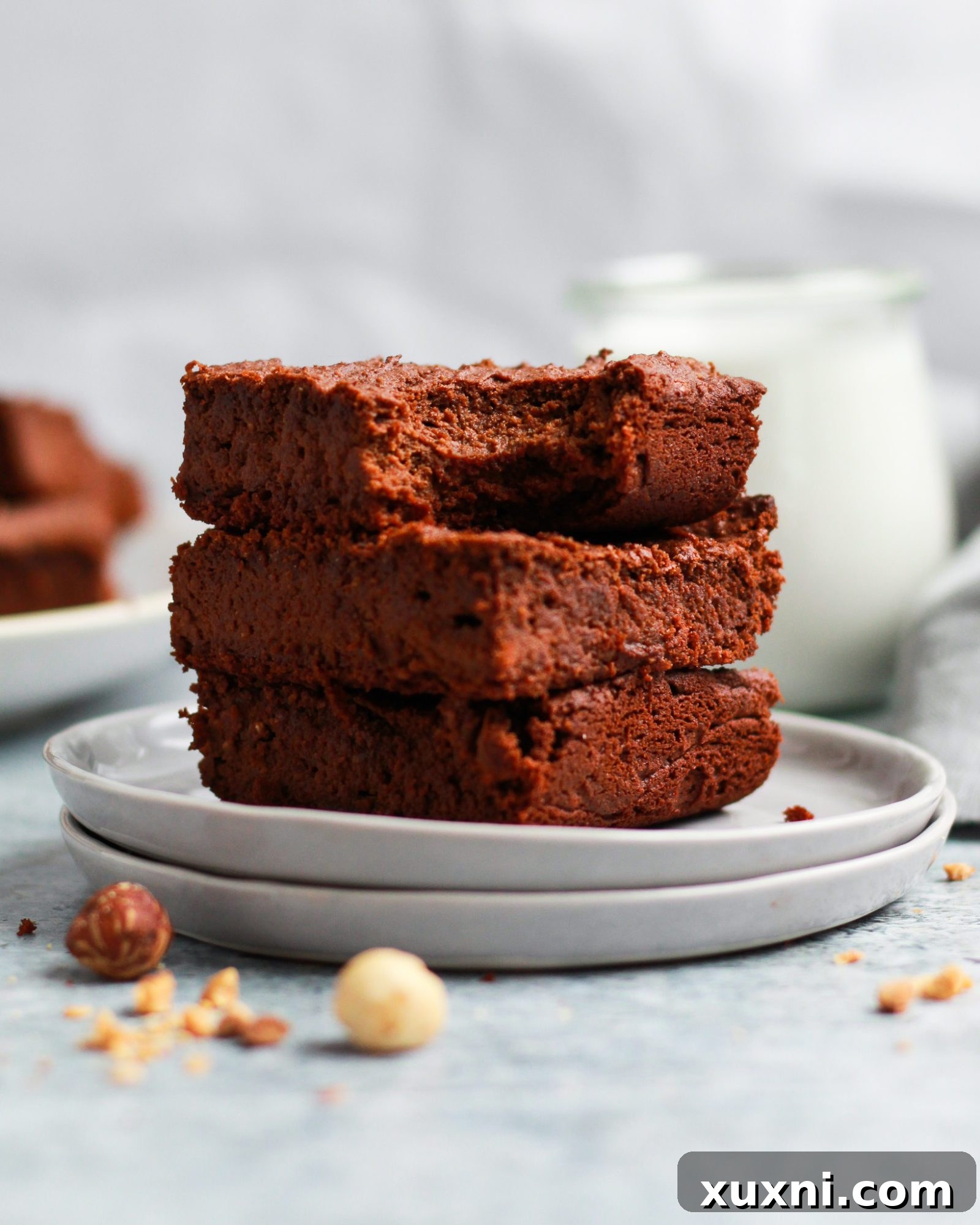 A stack of healthy vegan Nutella brownies, artfully presented and ready for tasting.