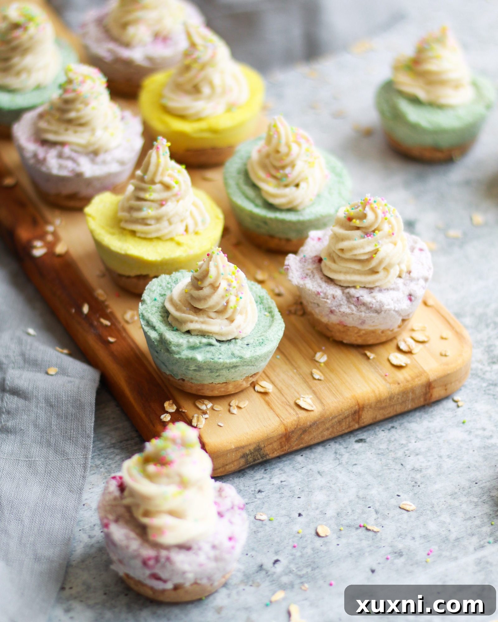 A close-up of a perfectly formed mini vegan cheesecake, ready for frosting.