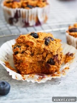 close up of vegan blueberry muffin with bite