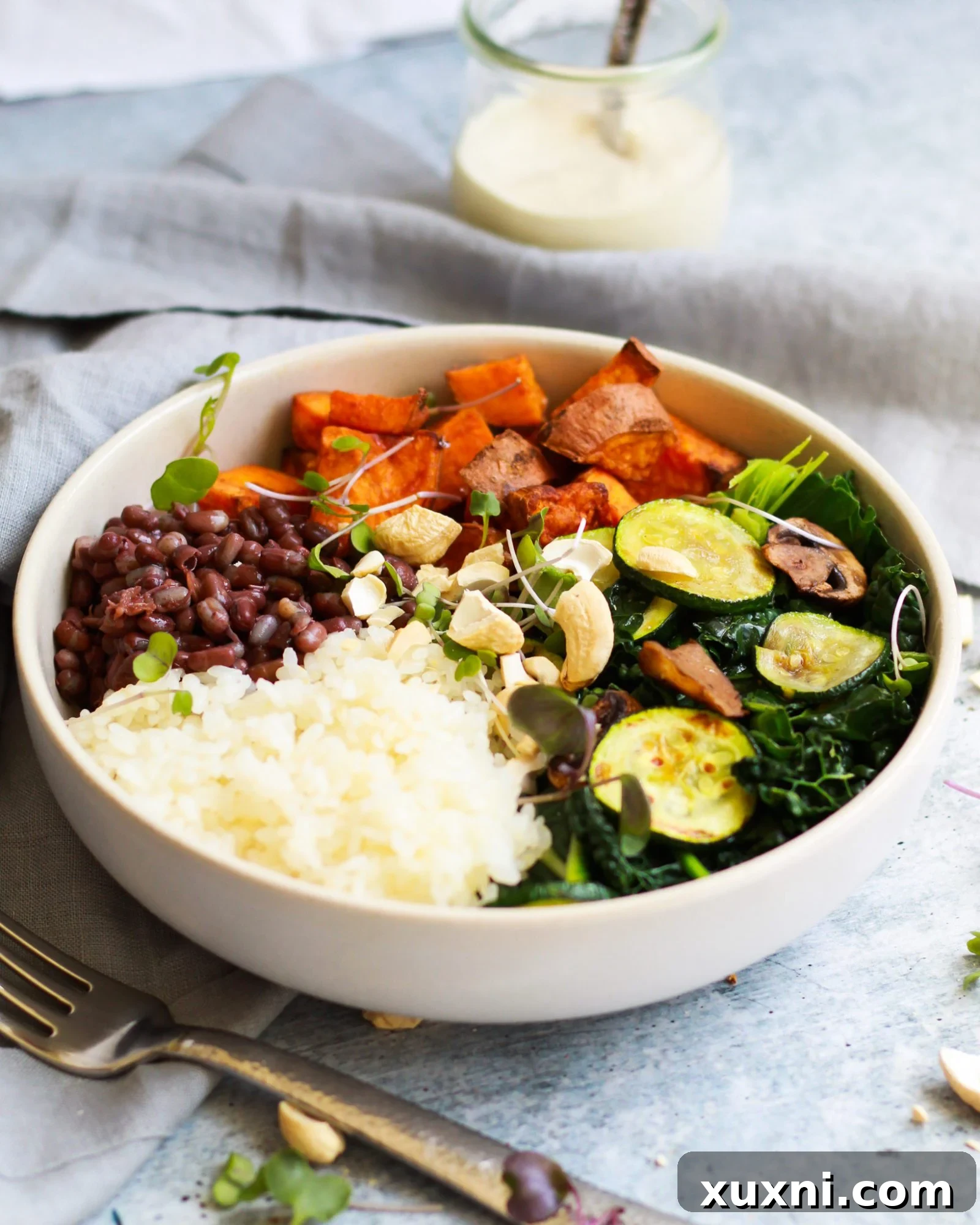 3/4 shot of macrobiotic bowl with vegan tahini sauce