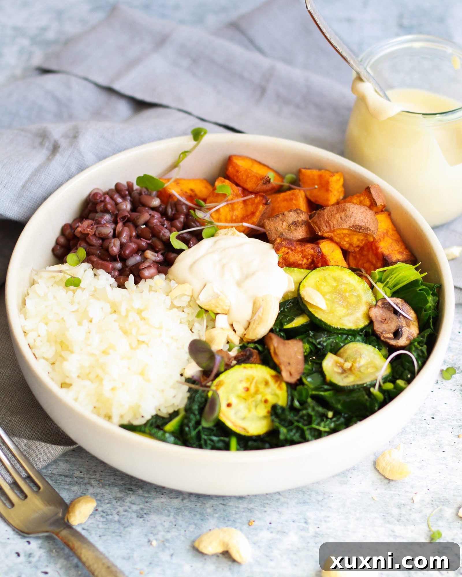 3/4 shot of macrobiotic bowl with vegan tahini sauce