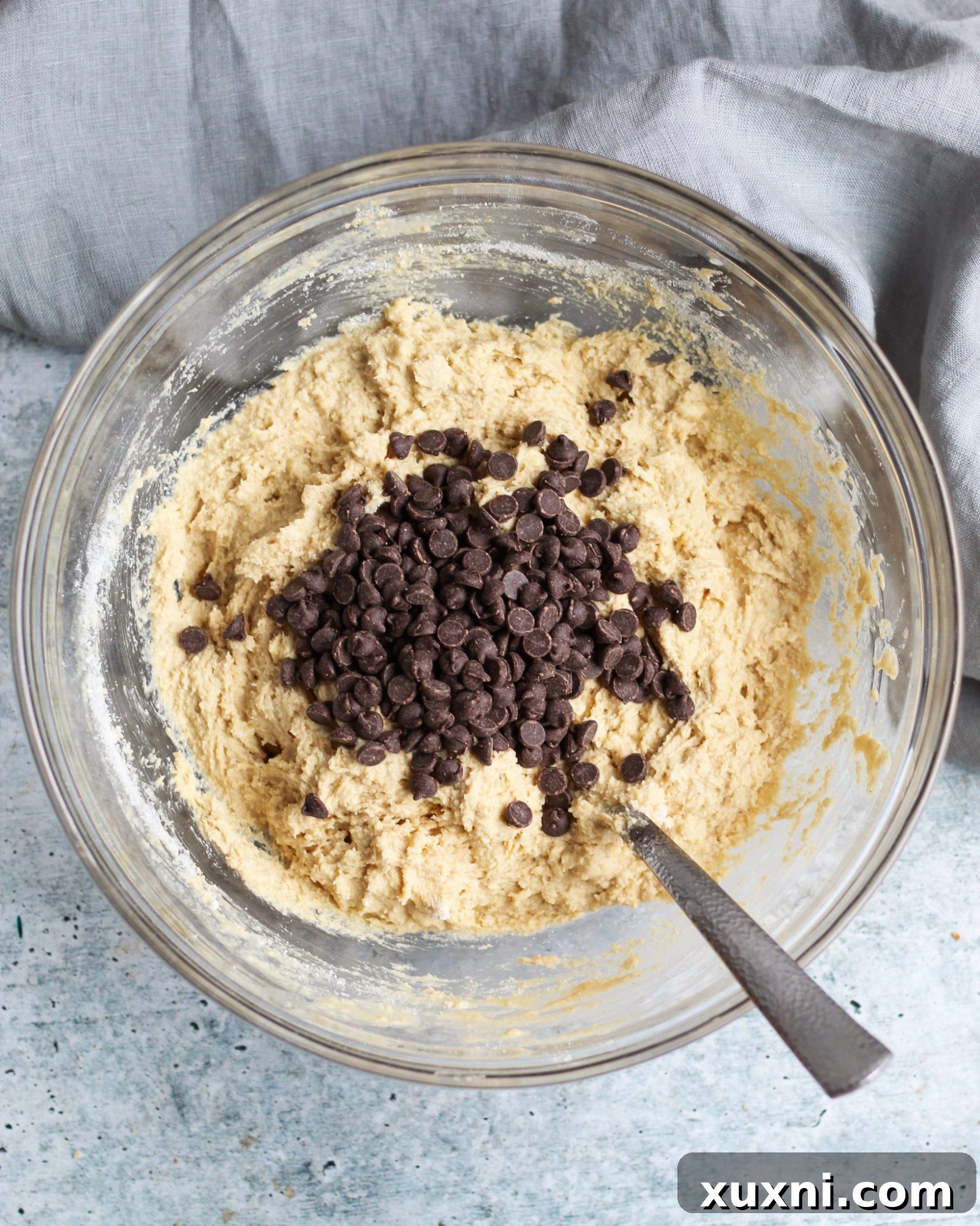 Close-up of chocolate chip scone dough with visible chocolate chips, ready for shaping