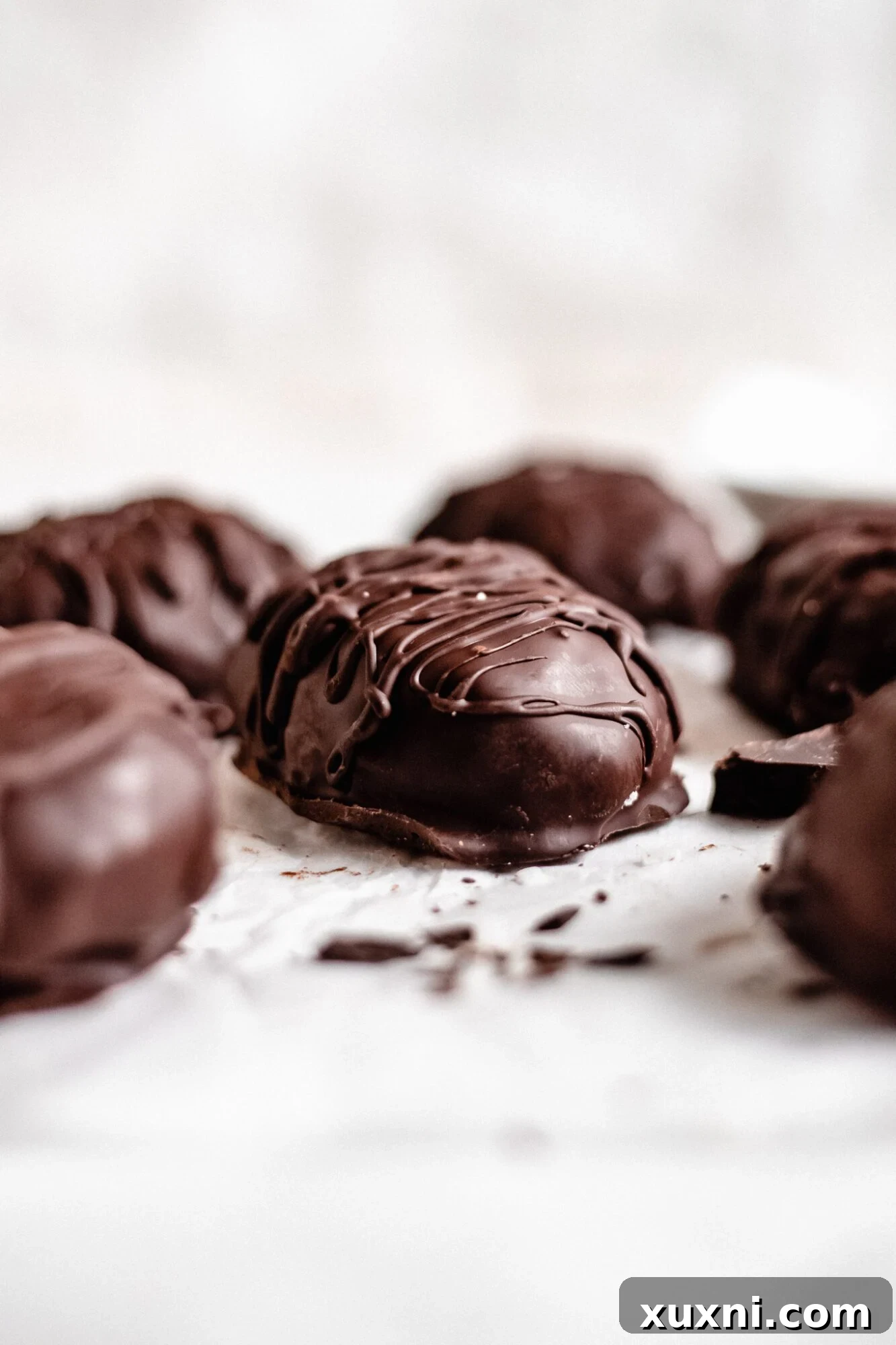 A collection of perfectly coated chocolate coconut cream eggs, demonstrating their readiness for celebration.