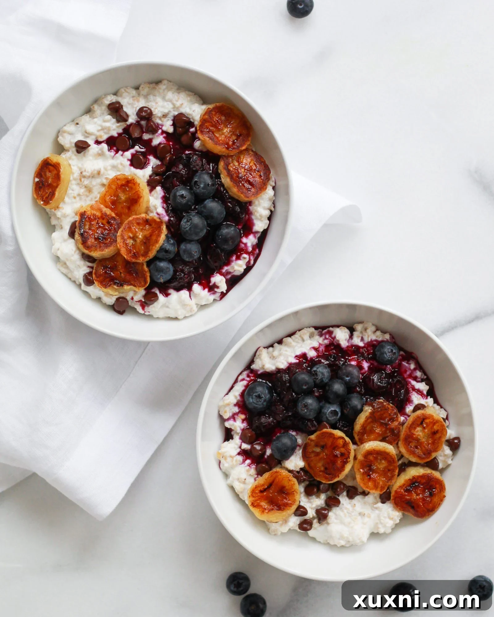 Two bowls of the creamiest, healthy oatmeal, ready to be served