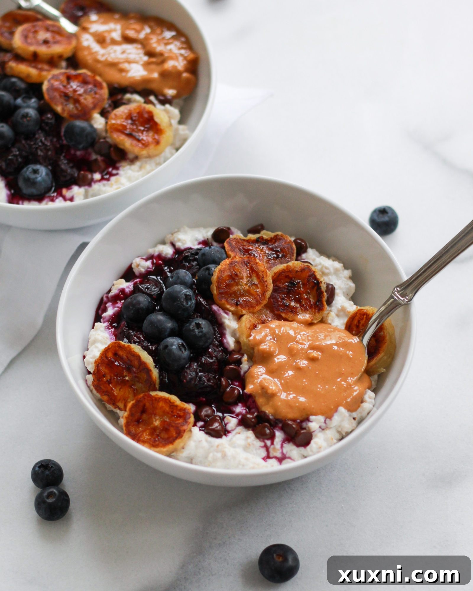 Three-quarter shot of creamy oatmeal with a swirl of peanut butter