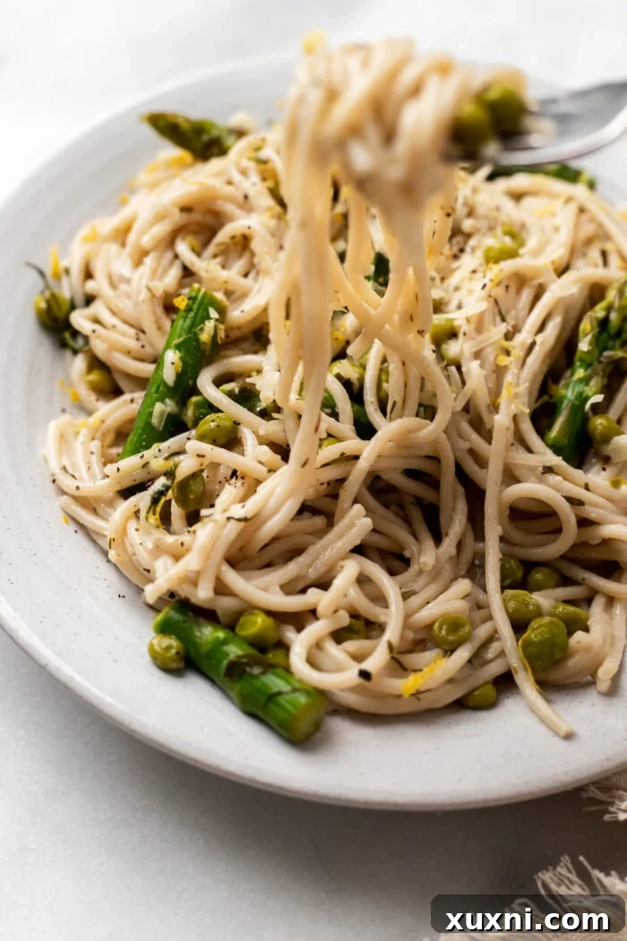 vegan lemon pasta with a fork in it