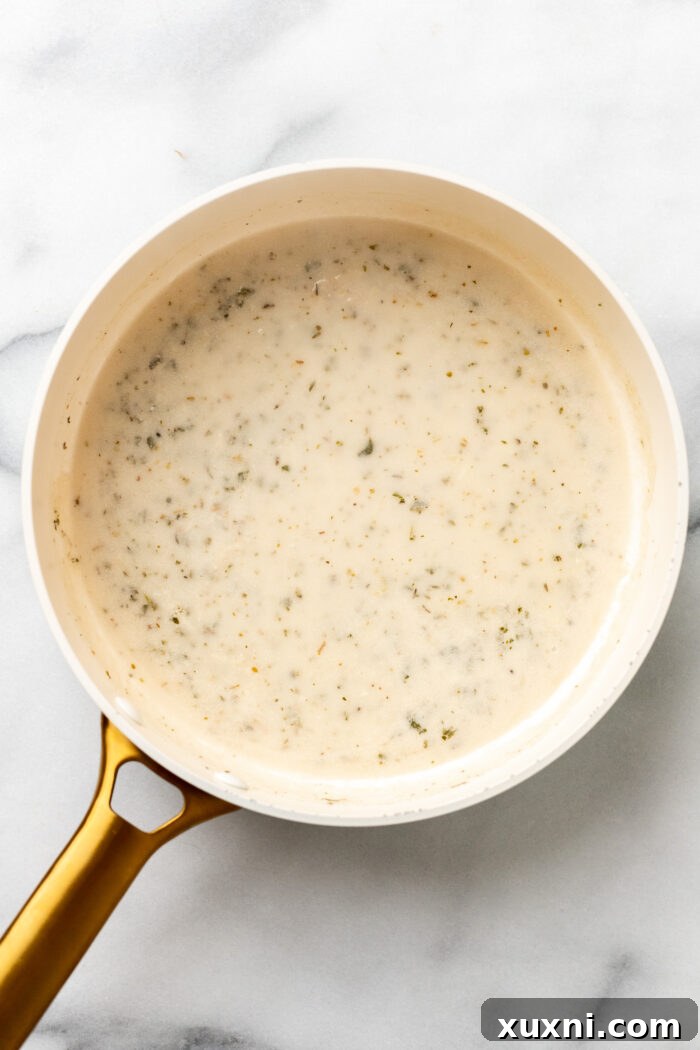 making the cream sauce in the pot