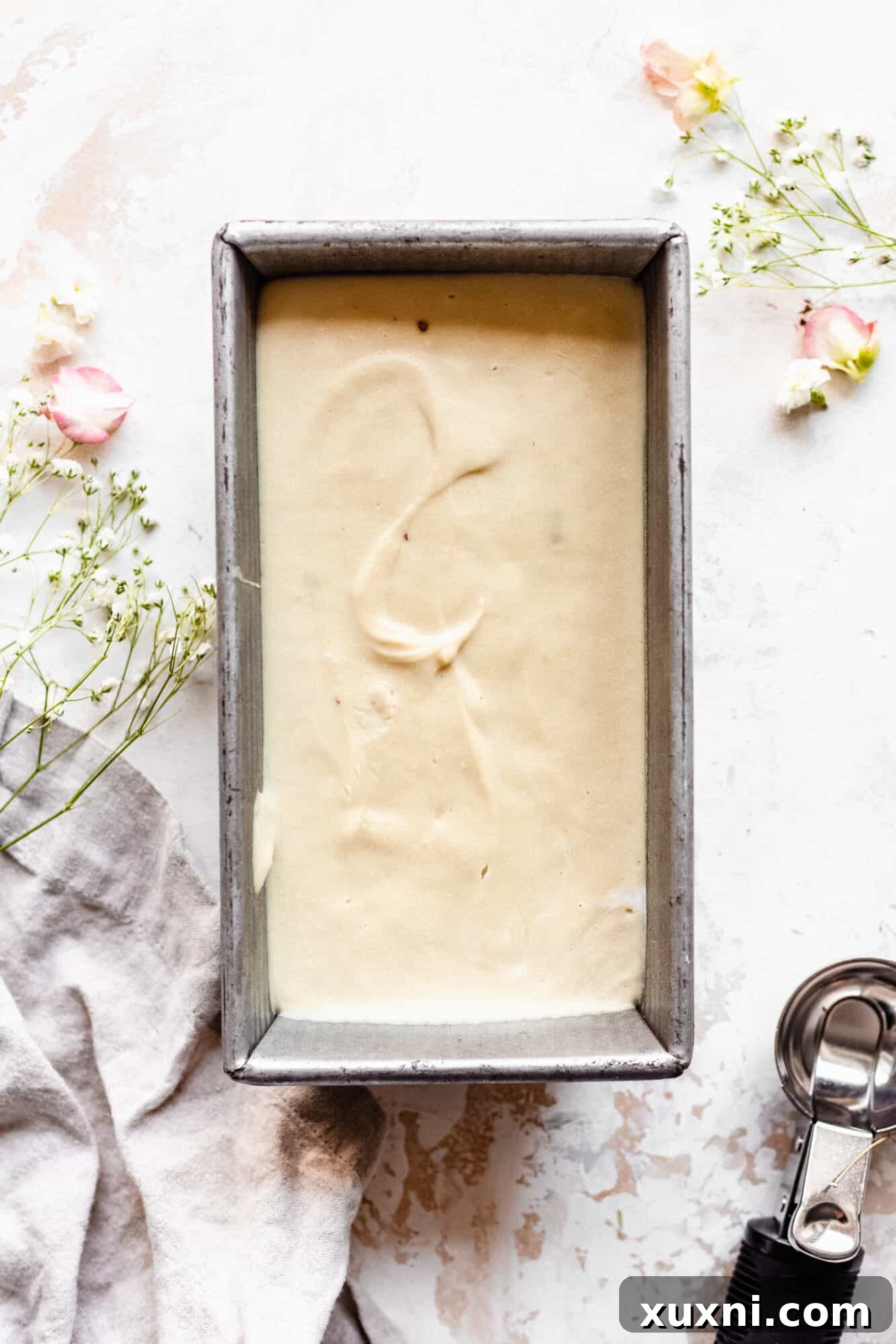 Frozen ice cream in a loaf pan, ready to scoop