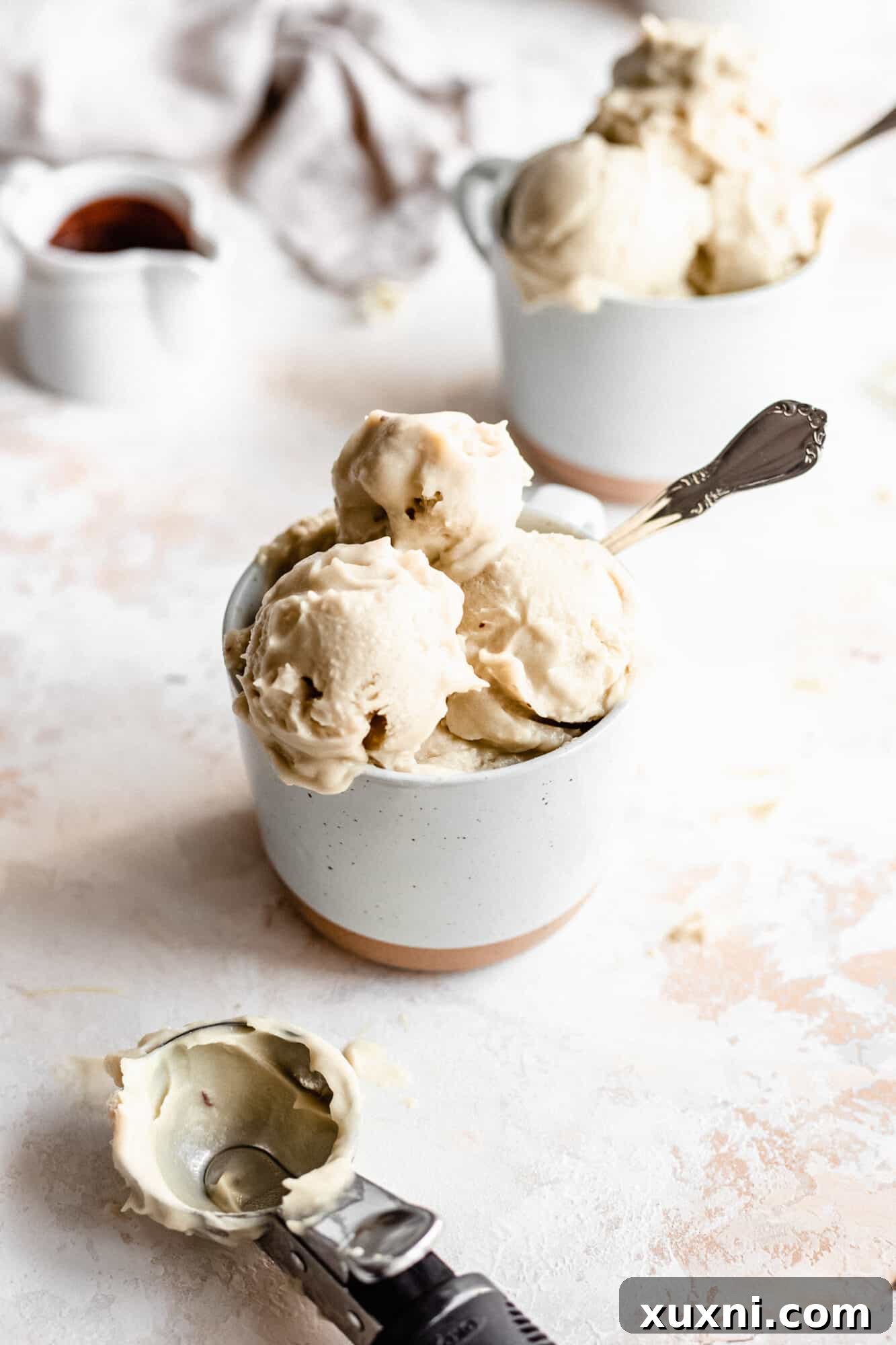 Mugs filled with vegan vanilla ice cream, ready to be served