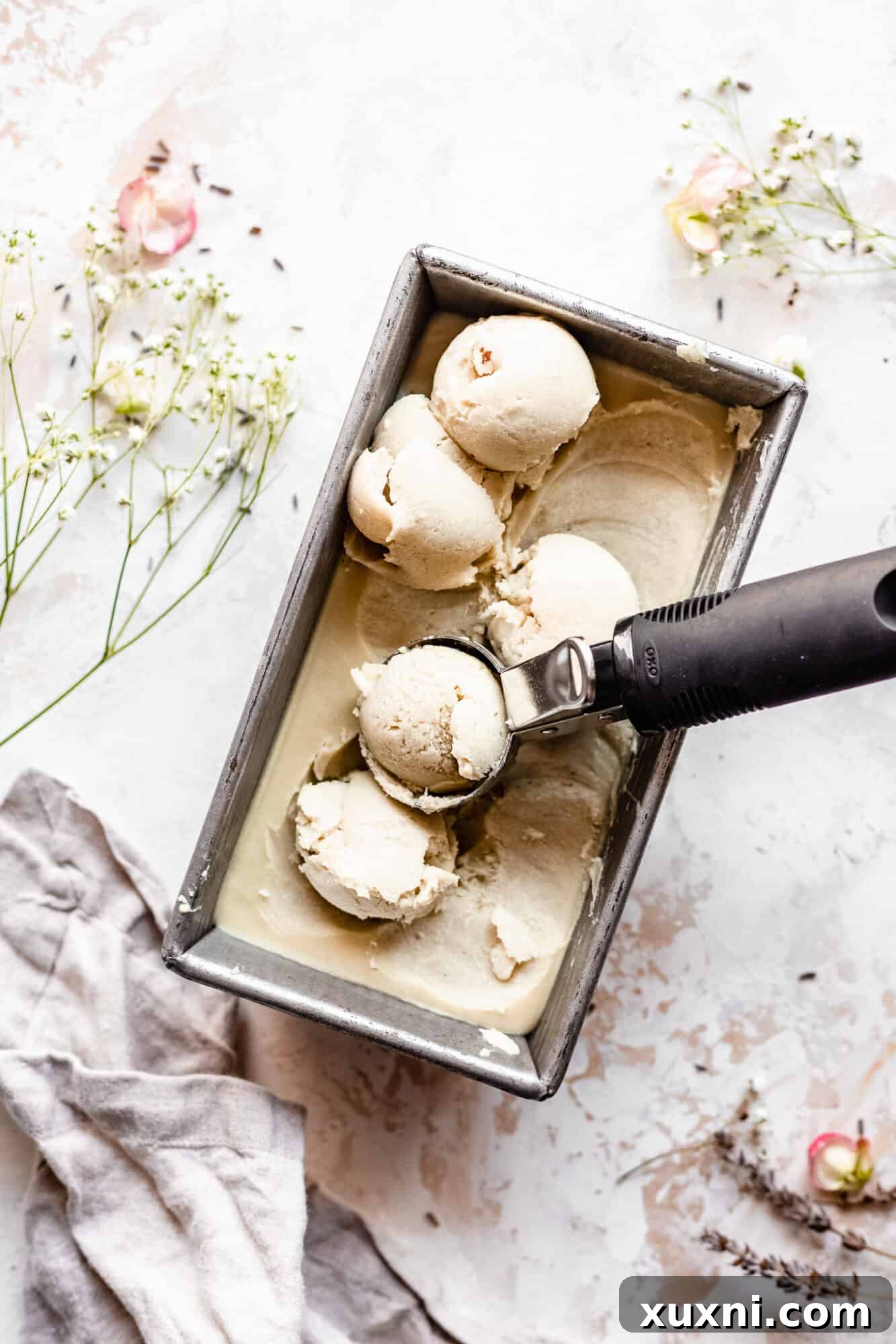 Scoops of vegan vanilla ice cream in a small bowl