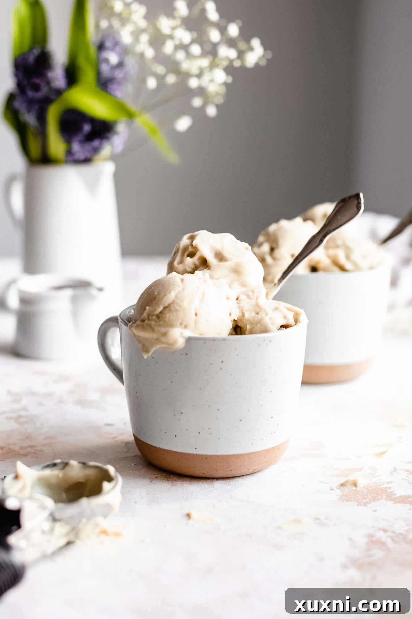 Scoops of paleo vanilla ice cream in a small mug
