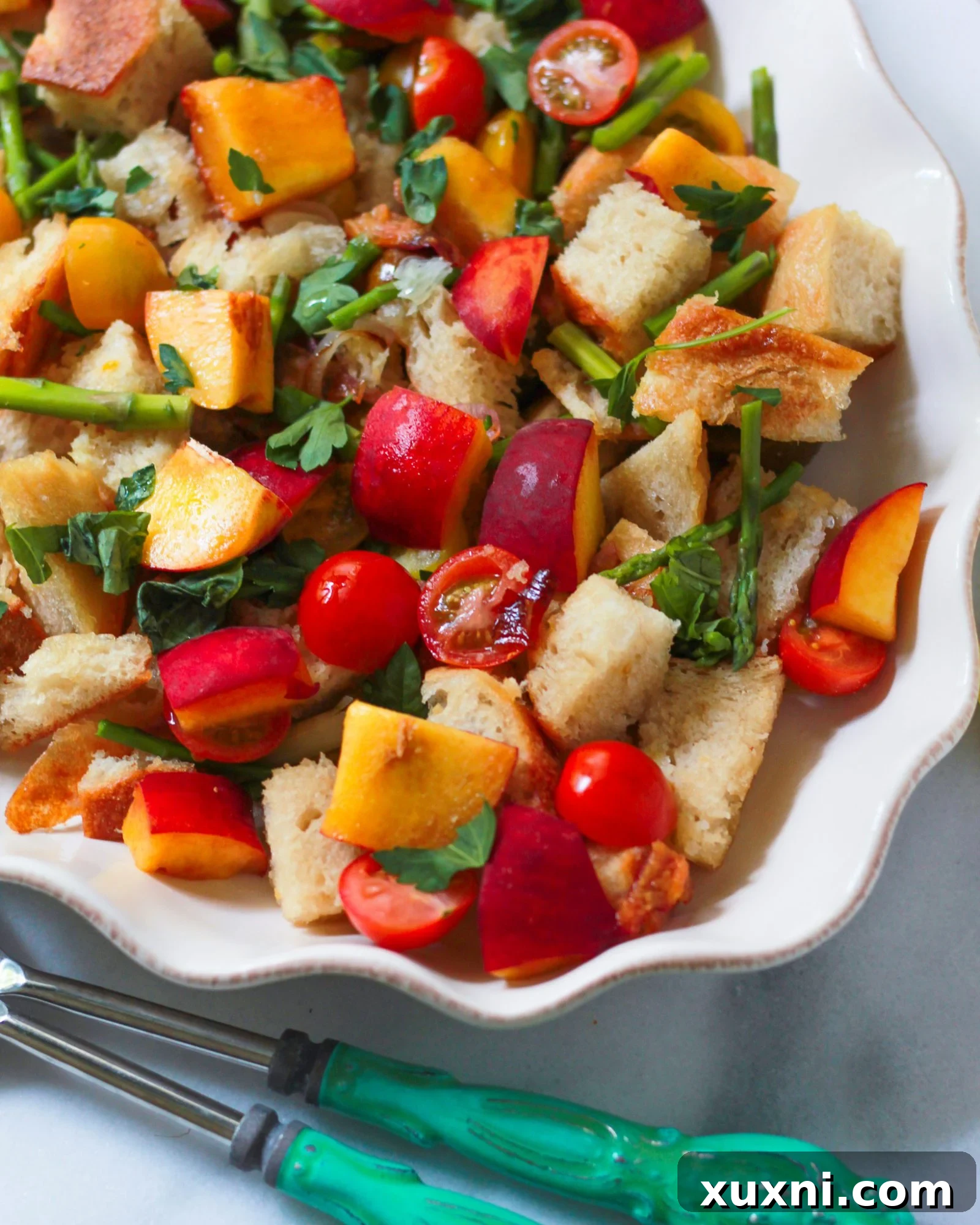 3/4 view of peach and tomato panzanella 