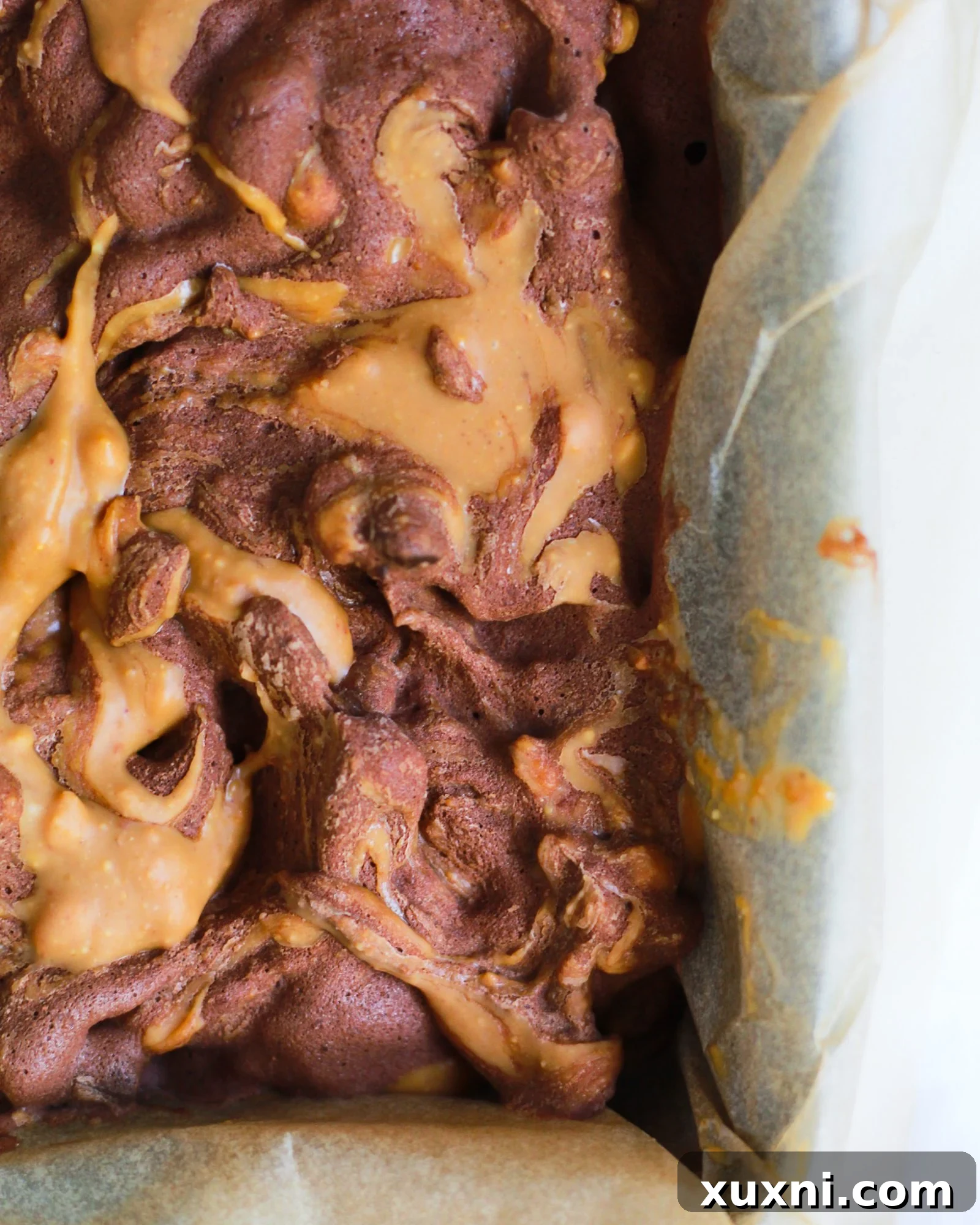 close up of peanut butter swirl in chocolate nice cream for Paleo option
