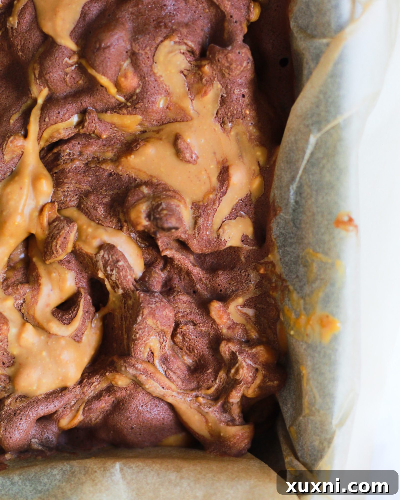 close up of peanut butter swirl in chocolate nice cream