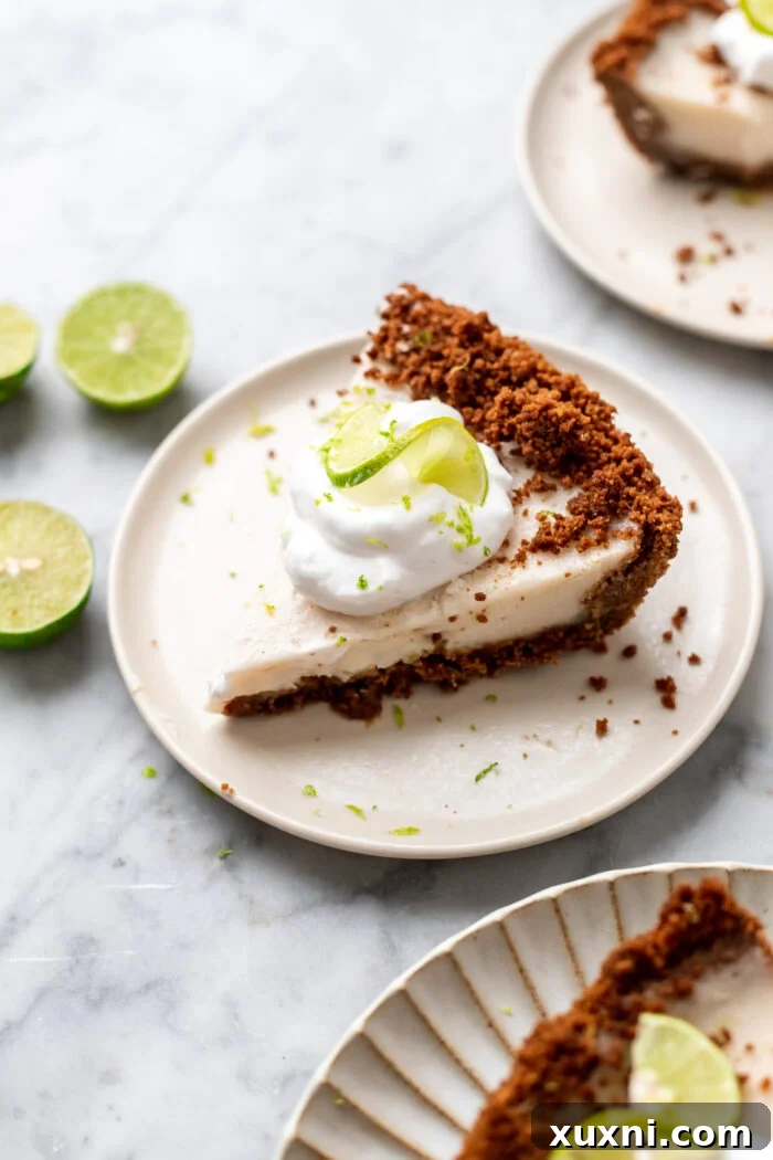 slices of vegan key lime pie, showing creamy green filling and a golden crust