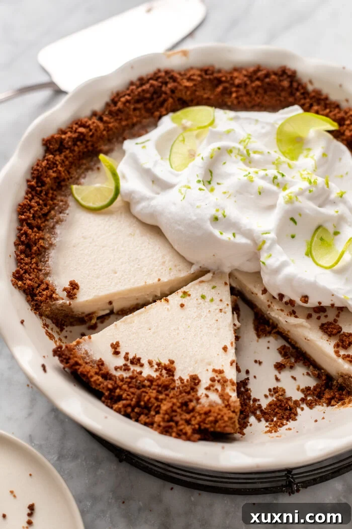 sliced vegan key lime pie with a perfect crust and filling