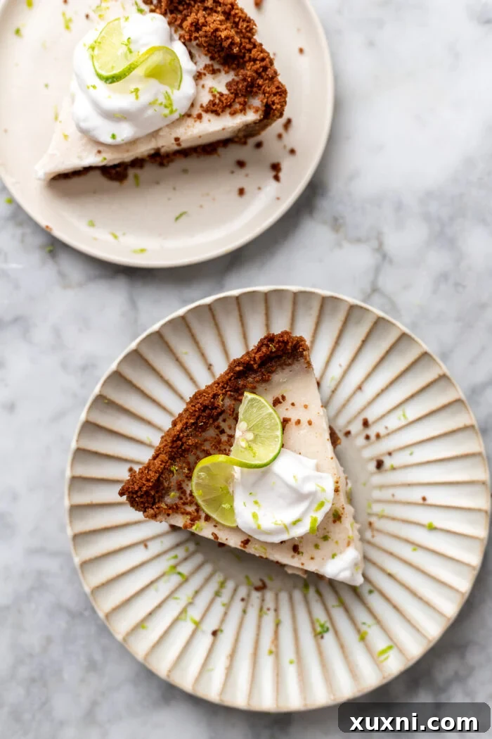 a perfect slice of vegan key lime pie on a plate, ready to be enjoyed