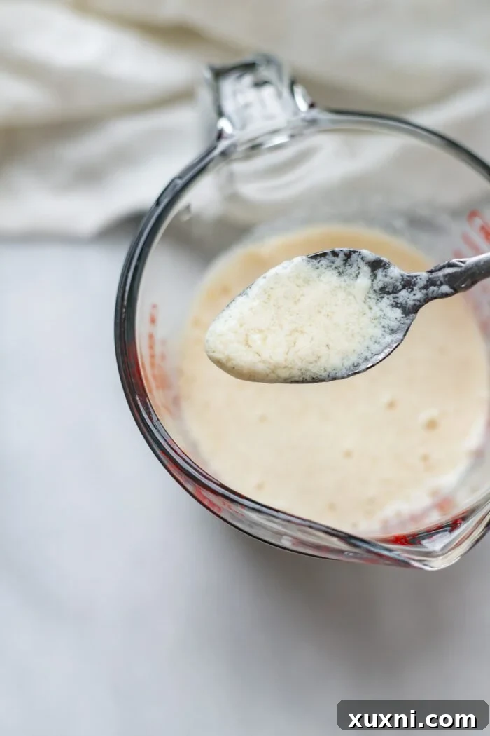 spoon showing curdles in vegan buttermilk