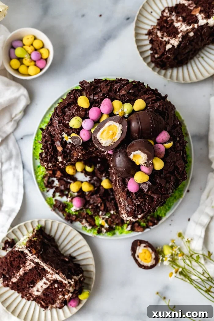 Overhead shot of a beautifully sliced vegan chocolate coconut Easter cake, revealing its moist layers and creamy frosting.