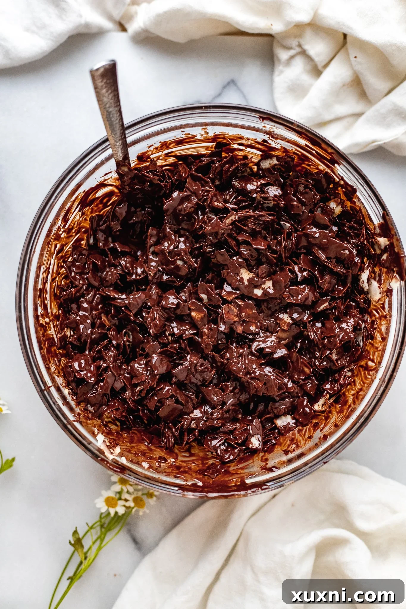 Toasted coconut flakes thoroughly coated in rich vegan chocolate.