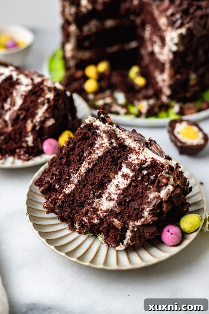 A delicious slice of vegan chocolate coconut cake, highlighting its moist layers and festive appeal.