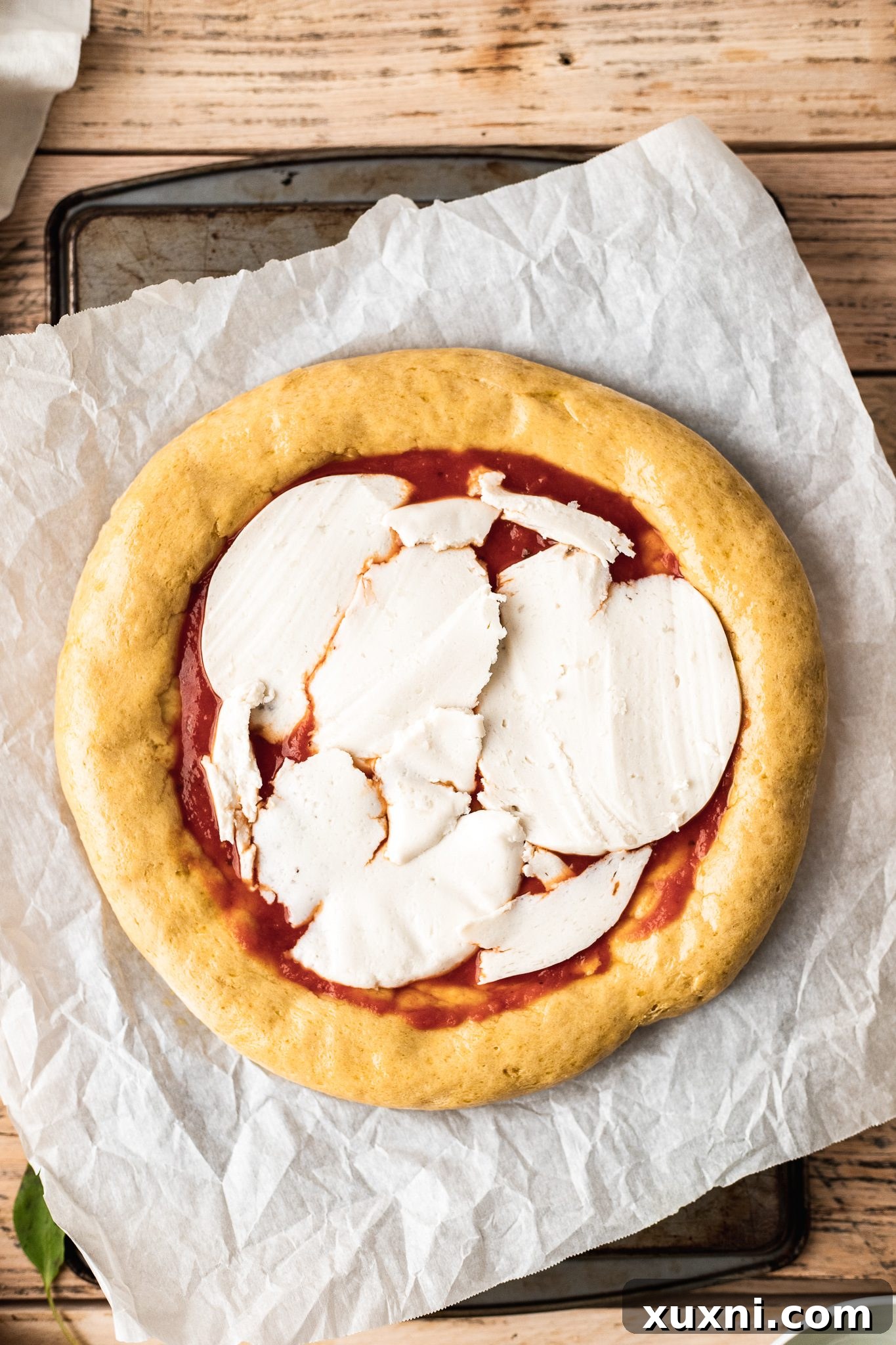 Gluten free pizza with toppings before final bake