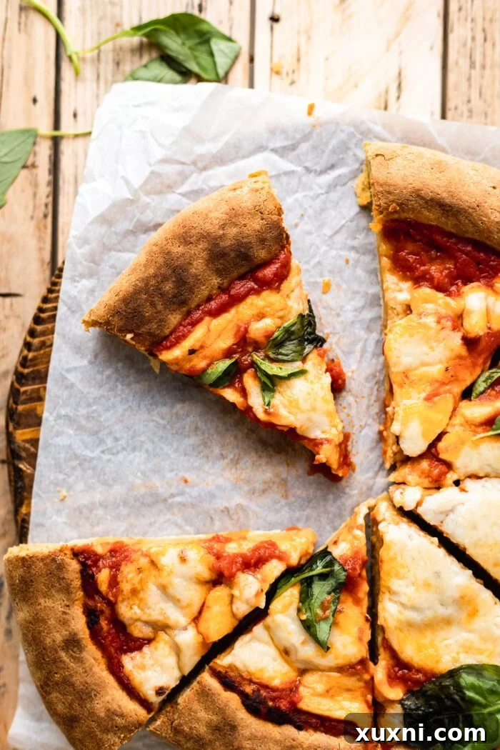 Slice of gluten free pizza on a pizza board