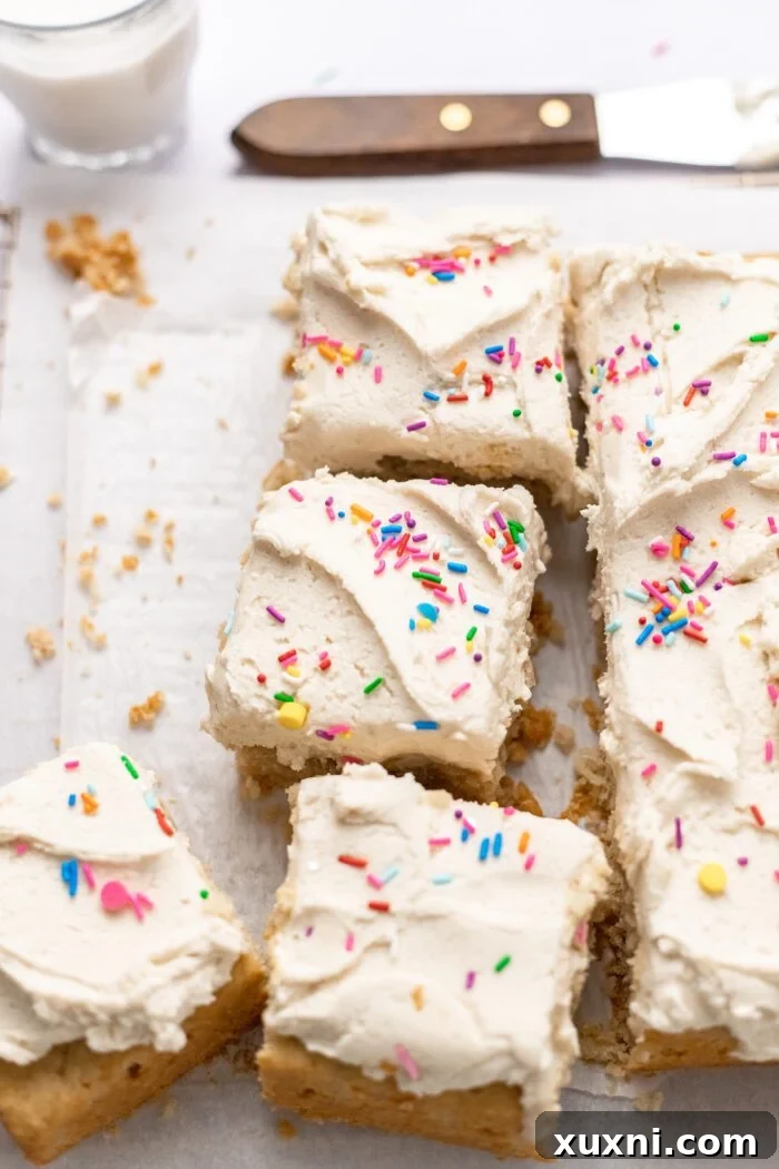 Easy & Delicious Vegan Vanilla Sheet Cake 3 sliced vanilla sheet cake showing the perfect crumb