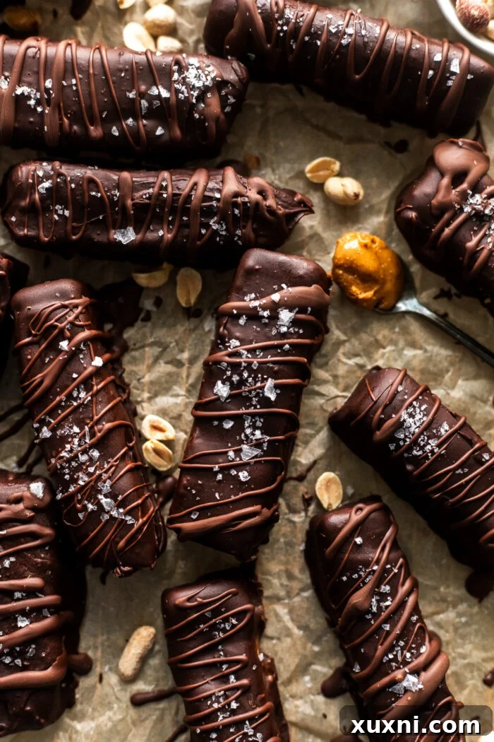 drizzled snickers bars on parchment paper 