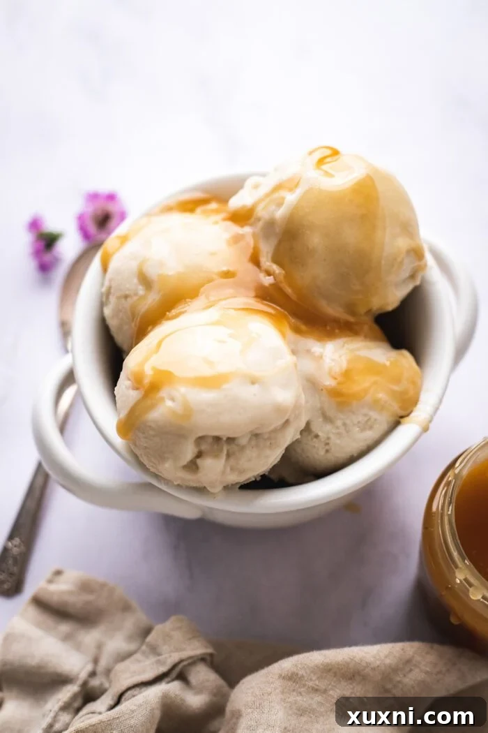Bowl of vegan vanilla ice cream with caramel sauce